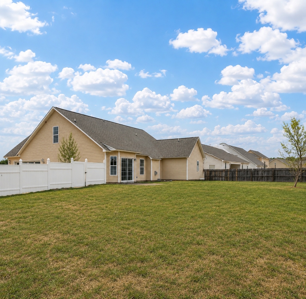Rear exterior and fenced backyard