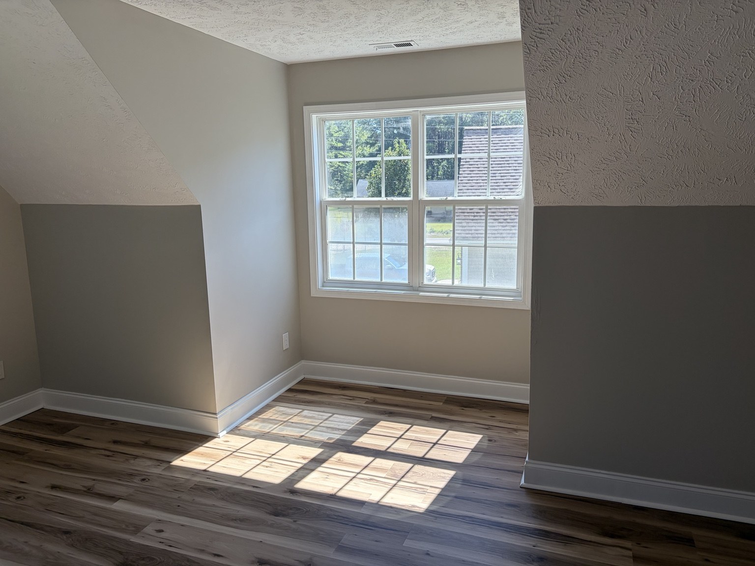Window nook beneath a sloped ceiling